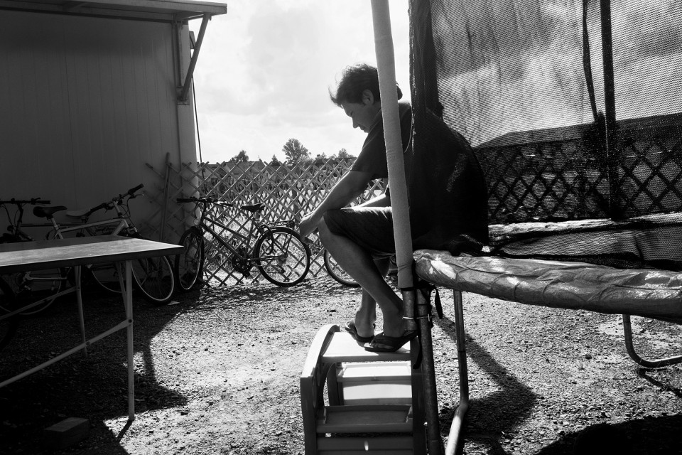 An Afghan refugee sitting on a new trampoline afghans, refugees, minors, attacks, fire, austria