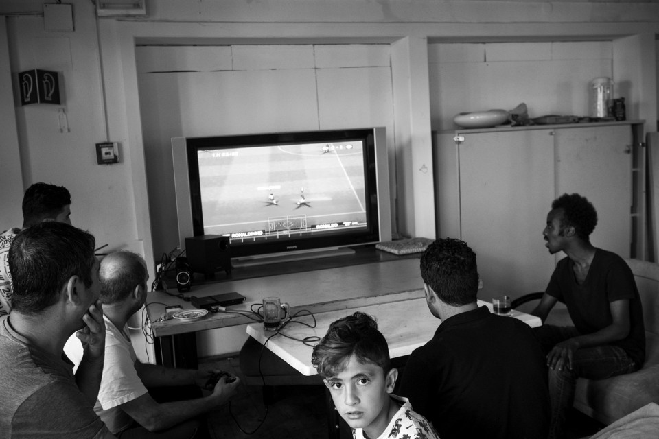 Playing football games at the asylum centre.