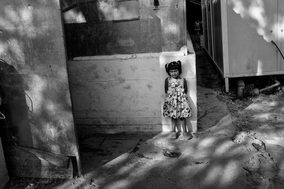 A girl inside the refugee camp Moria, Lesbos, Greece A girl inside the refugee camp Moria, Lesbos, Greece