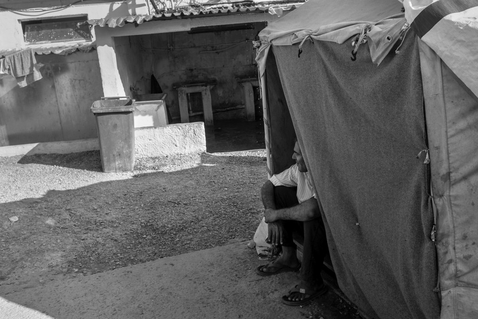 A Kurd inside his tent at the refugee camp Moria, Lesbos, Greece